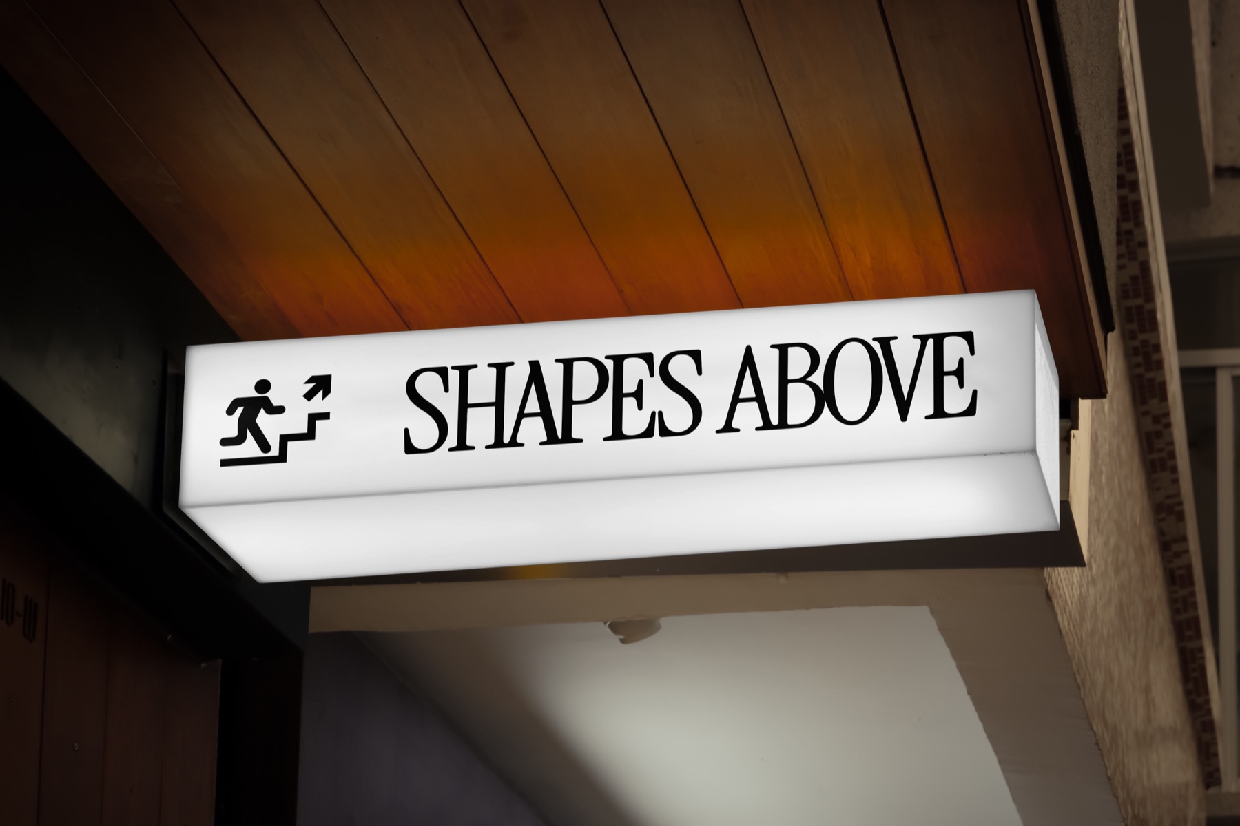 Illuminated Shapes Above studio sign